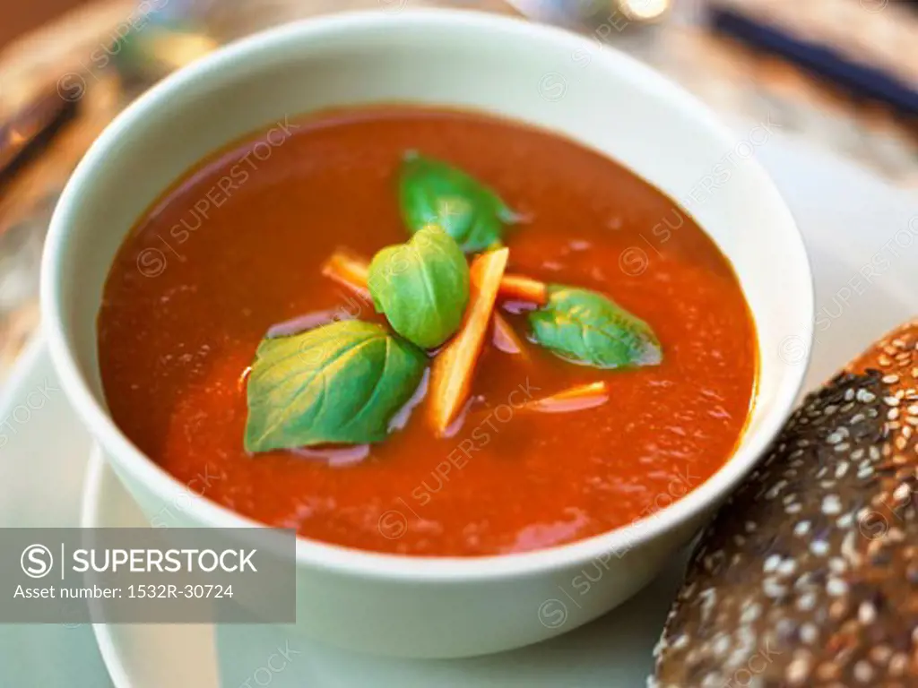 Creamed tomato soup with carrots and basil