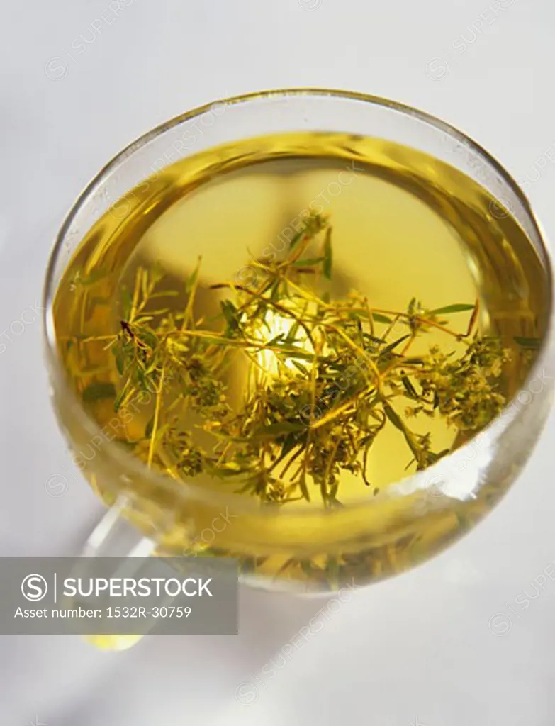 Thyme tea in a glass cup