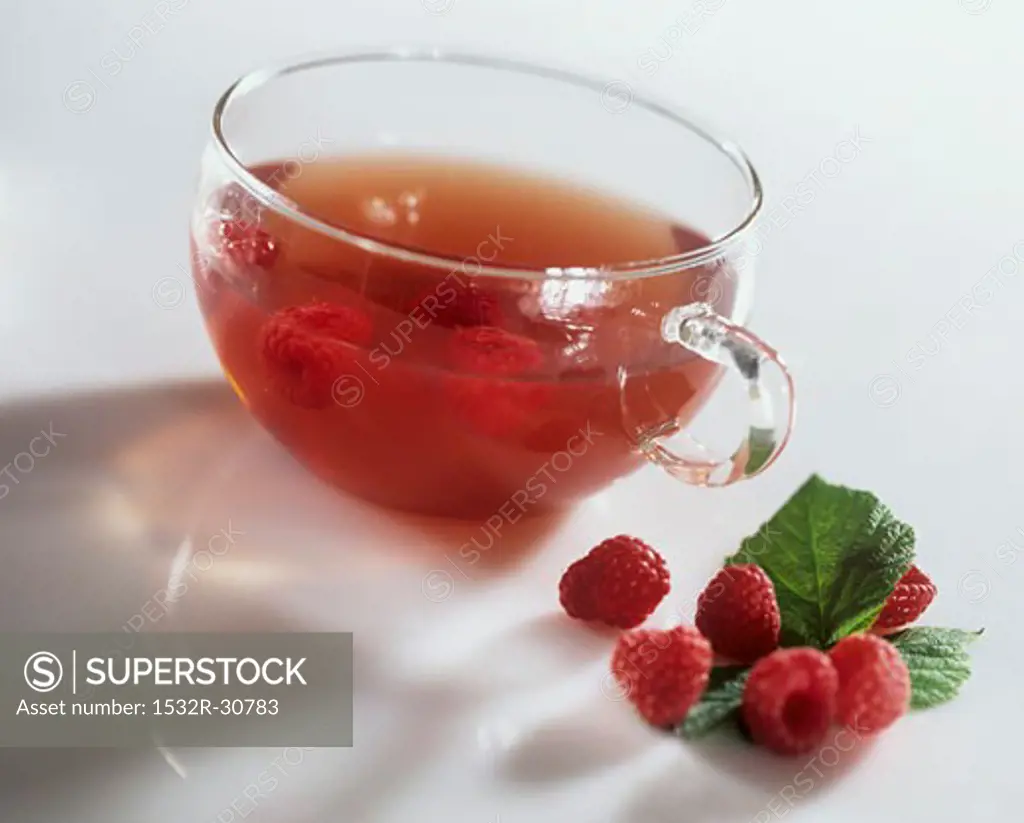 Raspberry tea in a glass cup