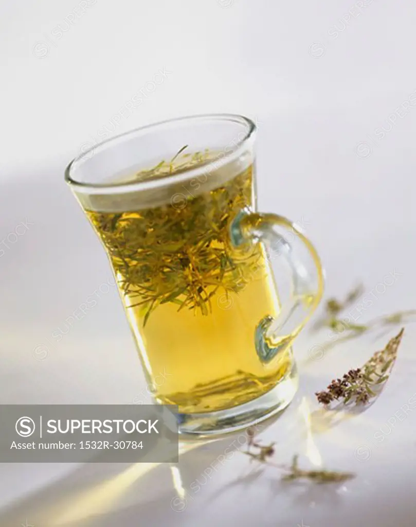 Thyme tea in a tea glass