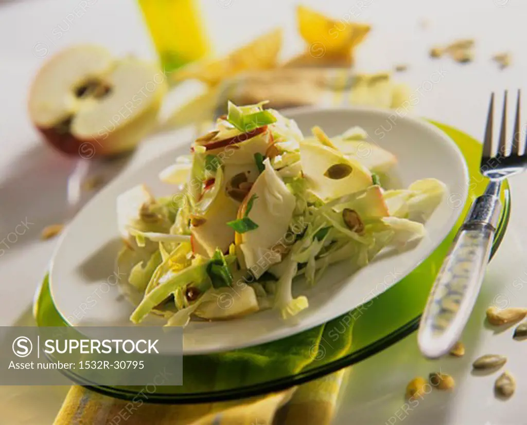 White cabbage and apple salad with pumpkin seeds