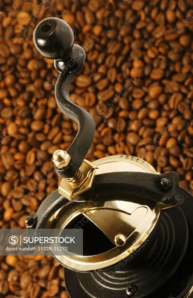 Coffee mill on coffee beans
