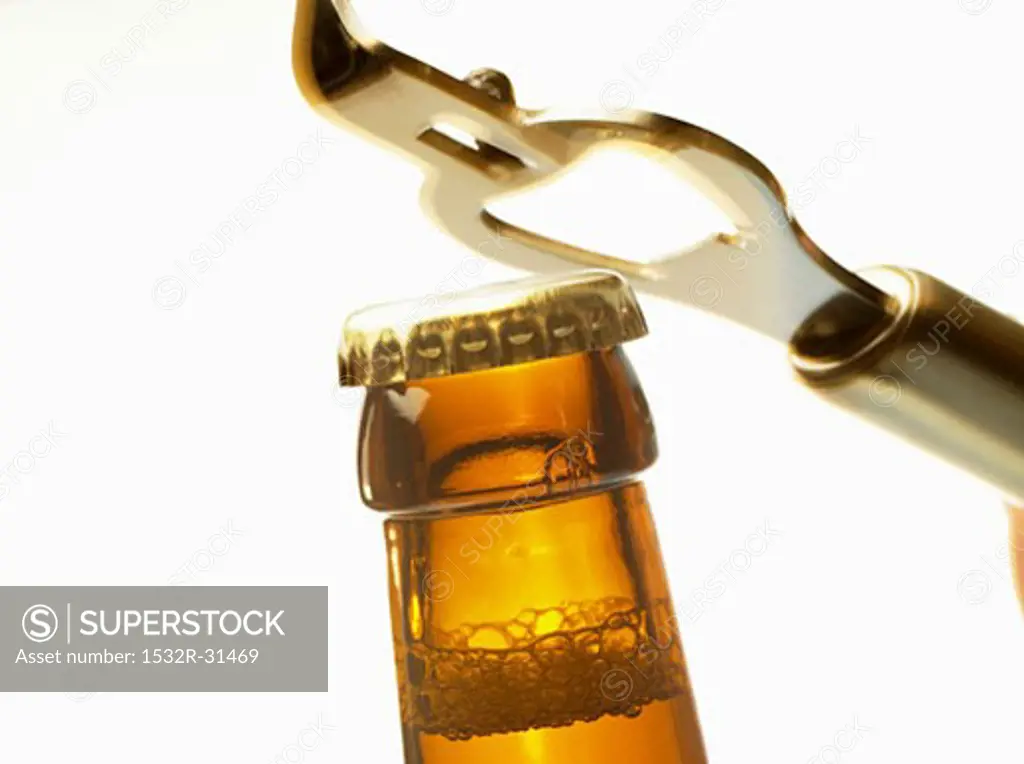 Beer bottle neck with crown cap and bottle opener