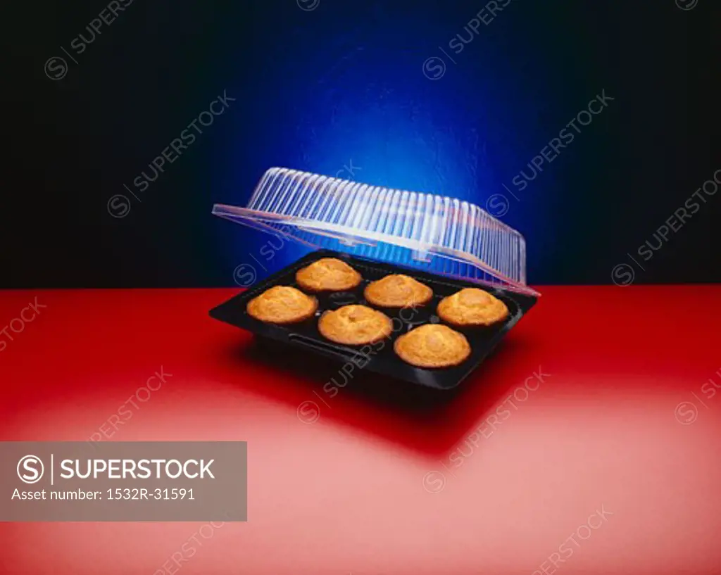 Six Muffins in an Opened Plastic Container