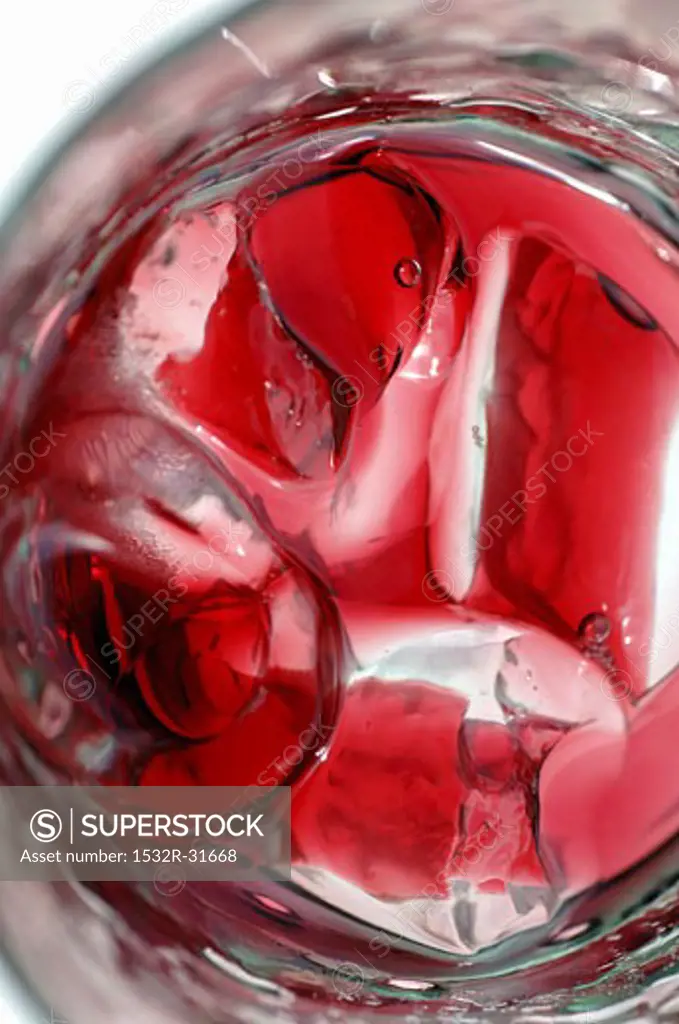 Red fruit juice with ice cubes