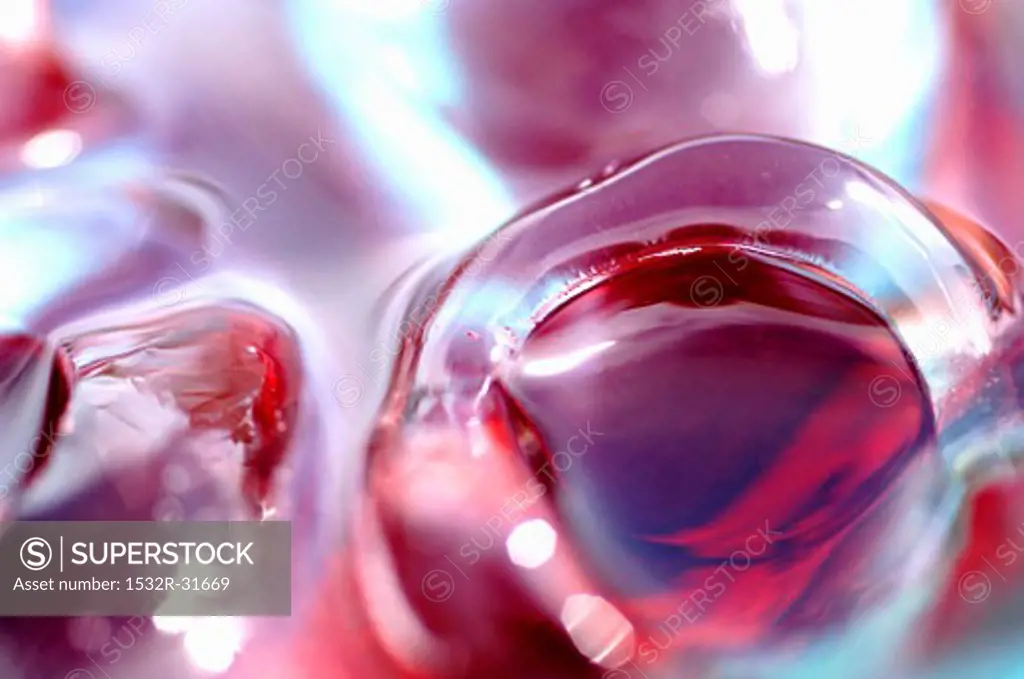 Ice cubes in red fruit juice