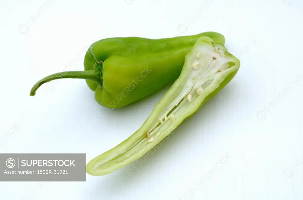 Half and whole green pointed pepper