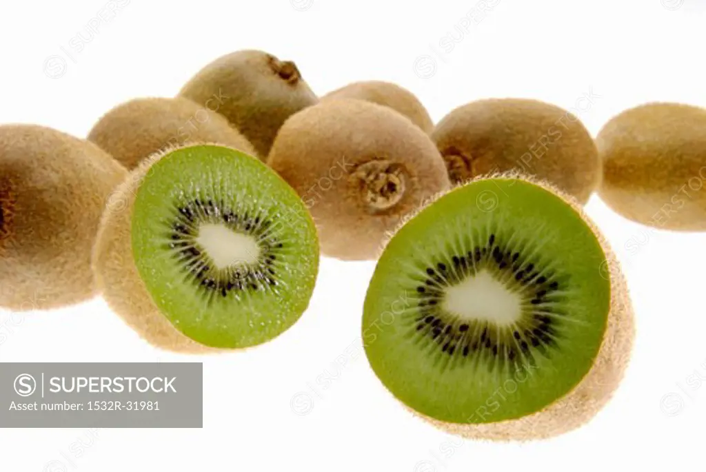 Kiwi fruits, one halved