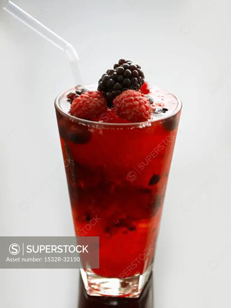A glass of berry cocktail with a straw