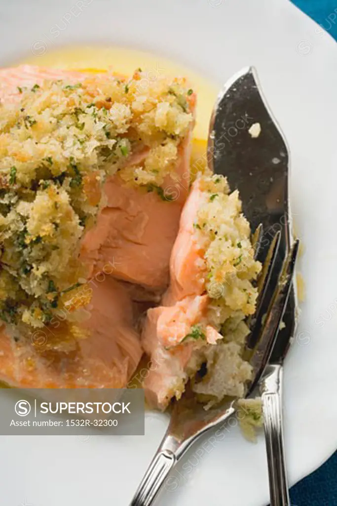 Salmon fillet with gratin topping, fish cutlery