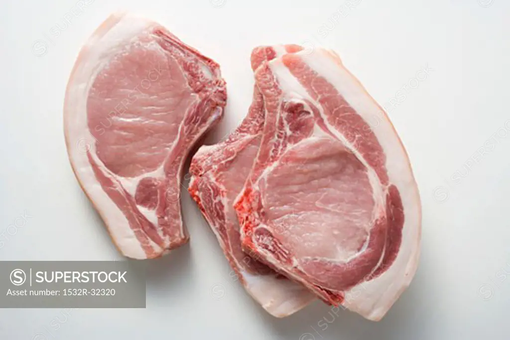 Three raw pork chops