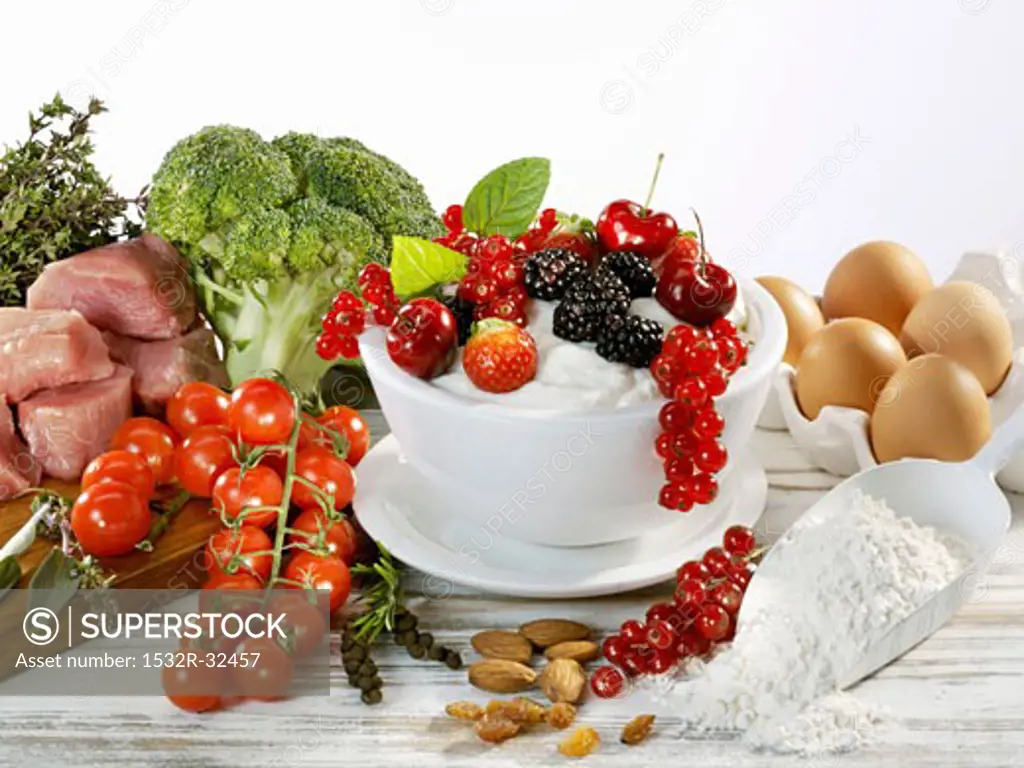 Still life with berries, vegetables, meat, flour, eggs