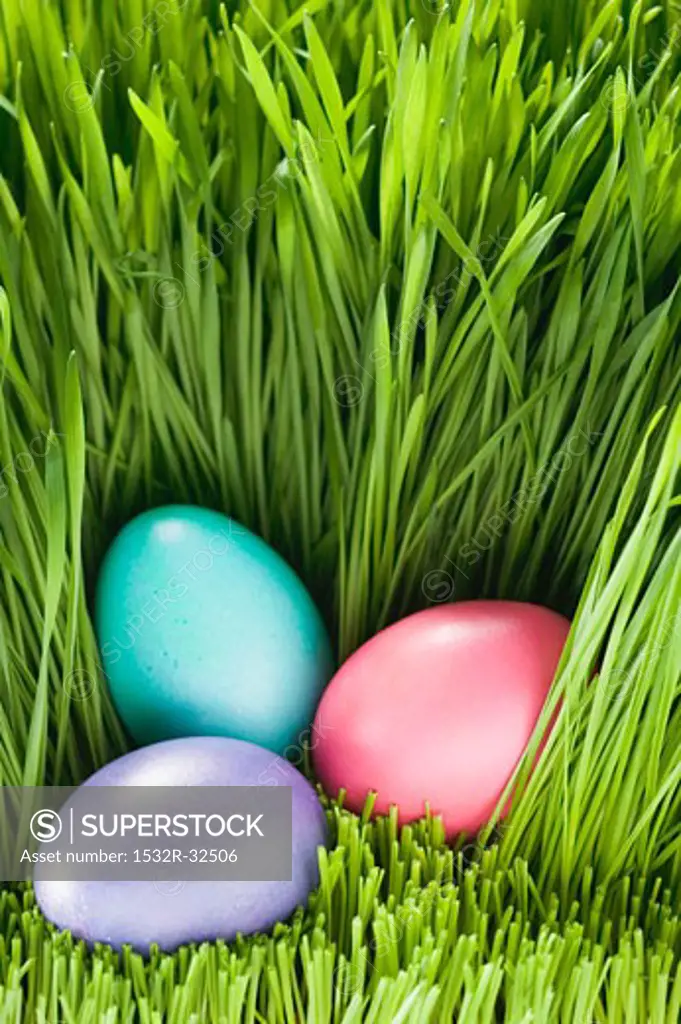 Three Easter eggs in grass