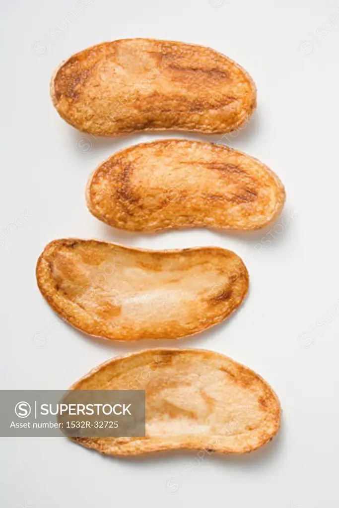 Four home-made potato crisps
