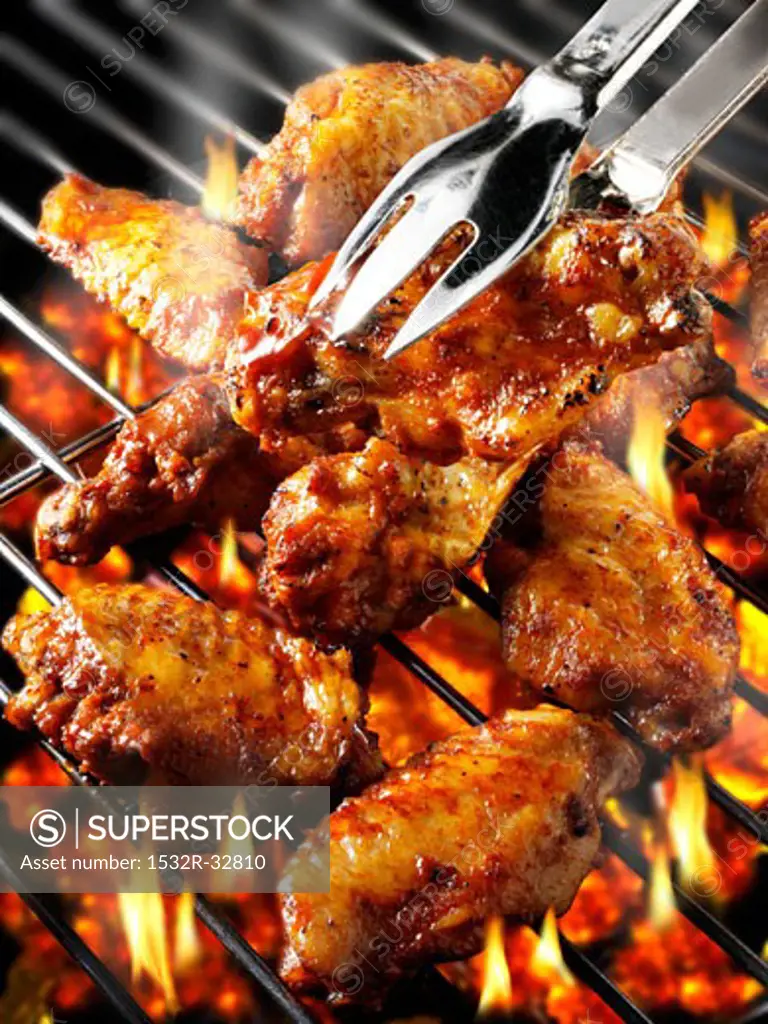 Chicken wings on barbecue rack