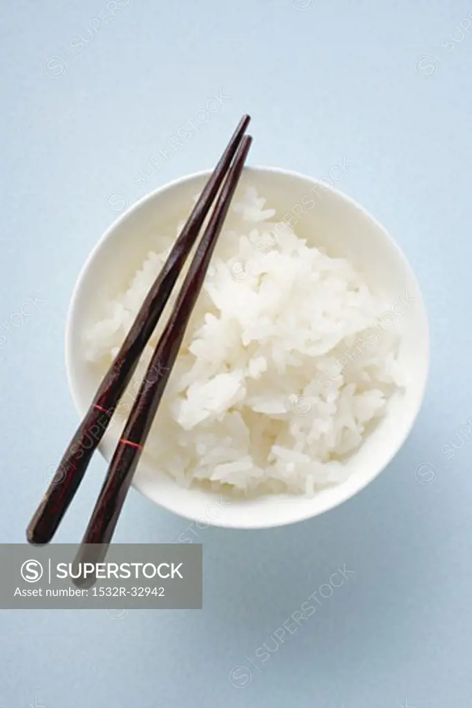 Bowl of rice with chopsticks