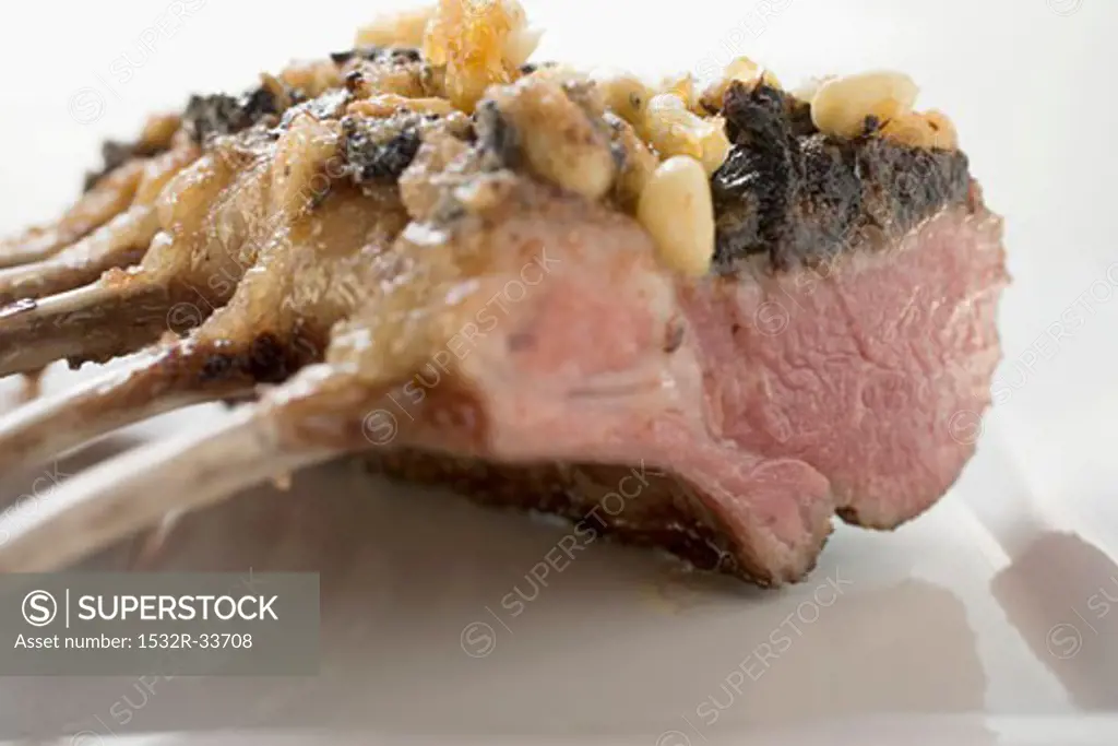 Rack of lamb with pesto crust and pine nuts
