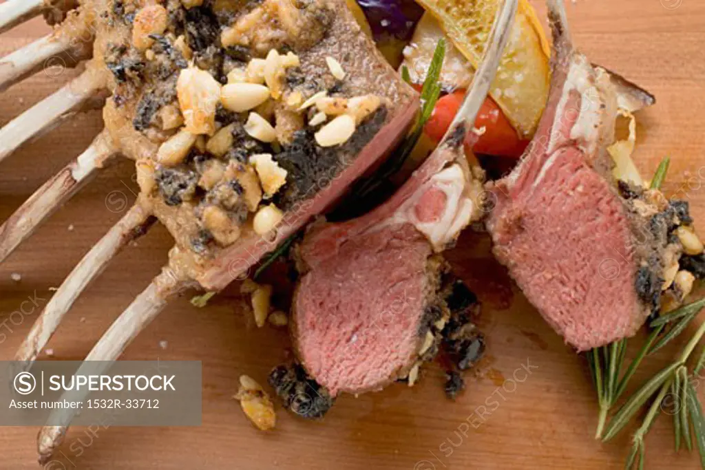 Rack of lamb with pesto and pine nut crust, vegetables