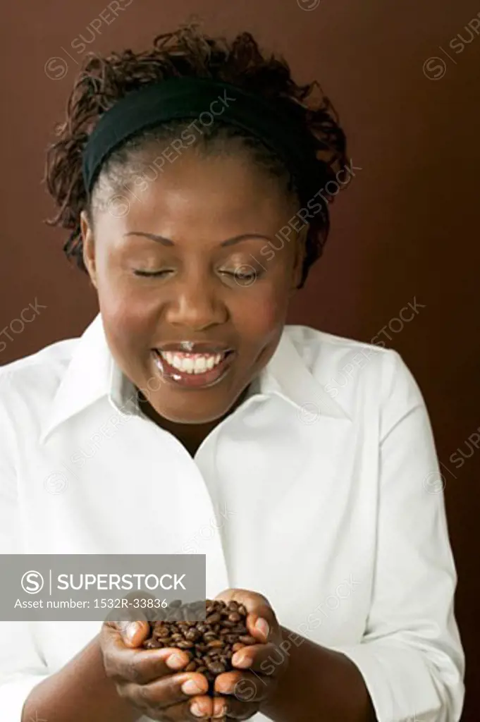 Woman holding coffee beans