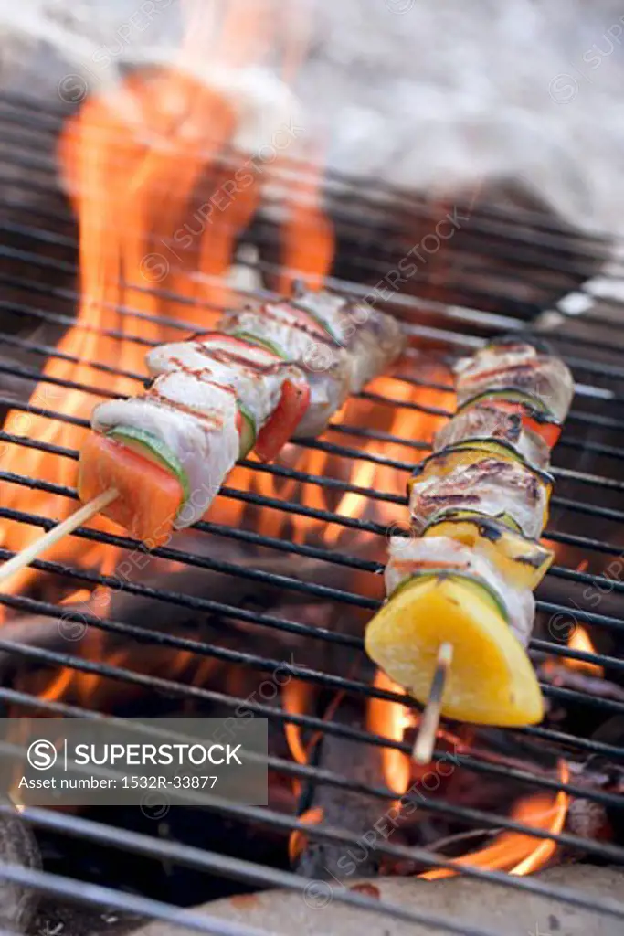 Poultry kebabs on barbecue grill rack