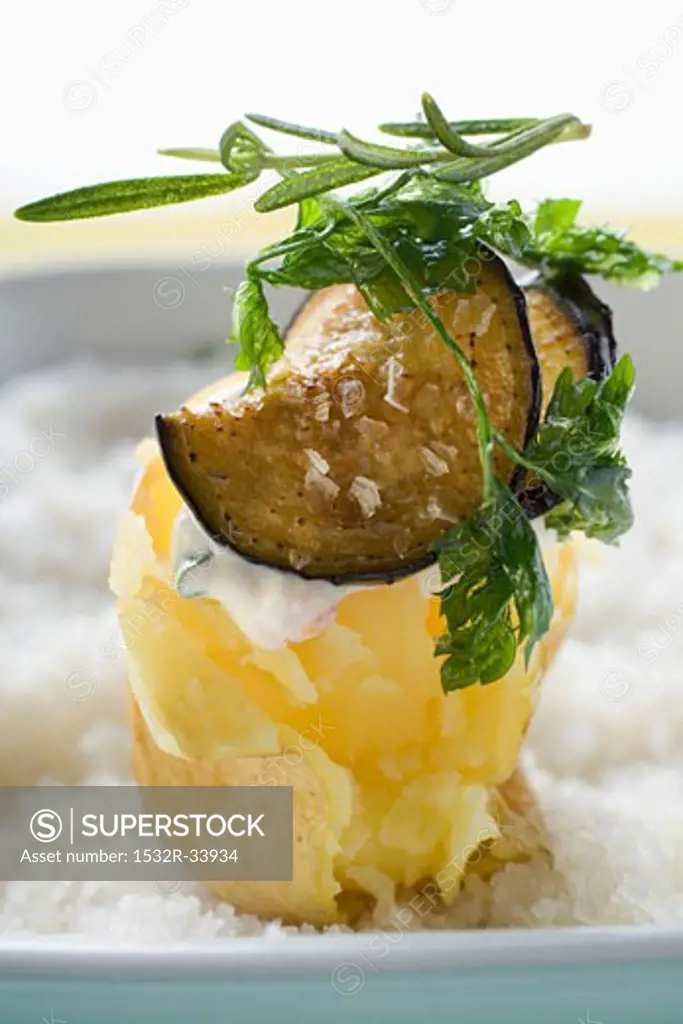 Baked potato with aubergine and deep-fried herbs