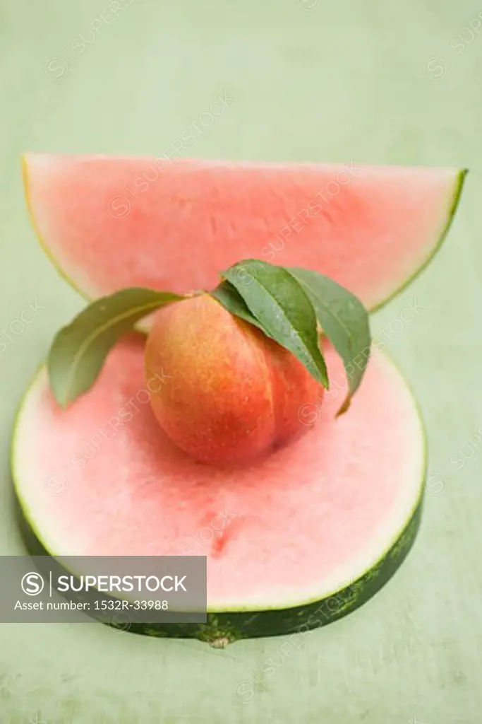 Nectarine with leaves, slice and wedge of watermelon
