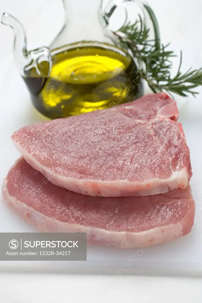 Two pork chops, olive oil, rosemary