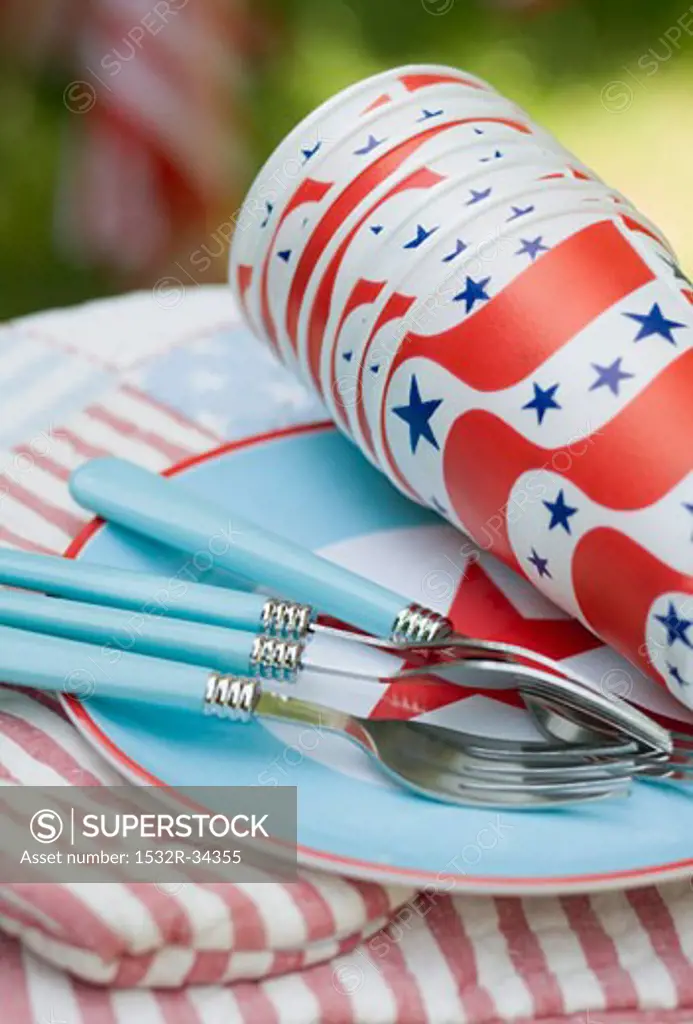 Paper cups and forks on a plate for the 4th of July (USA)
