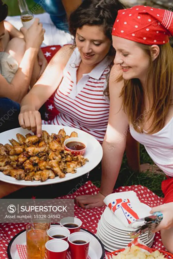 Young women at a 4th of July picnic (USA)