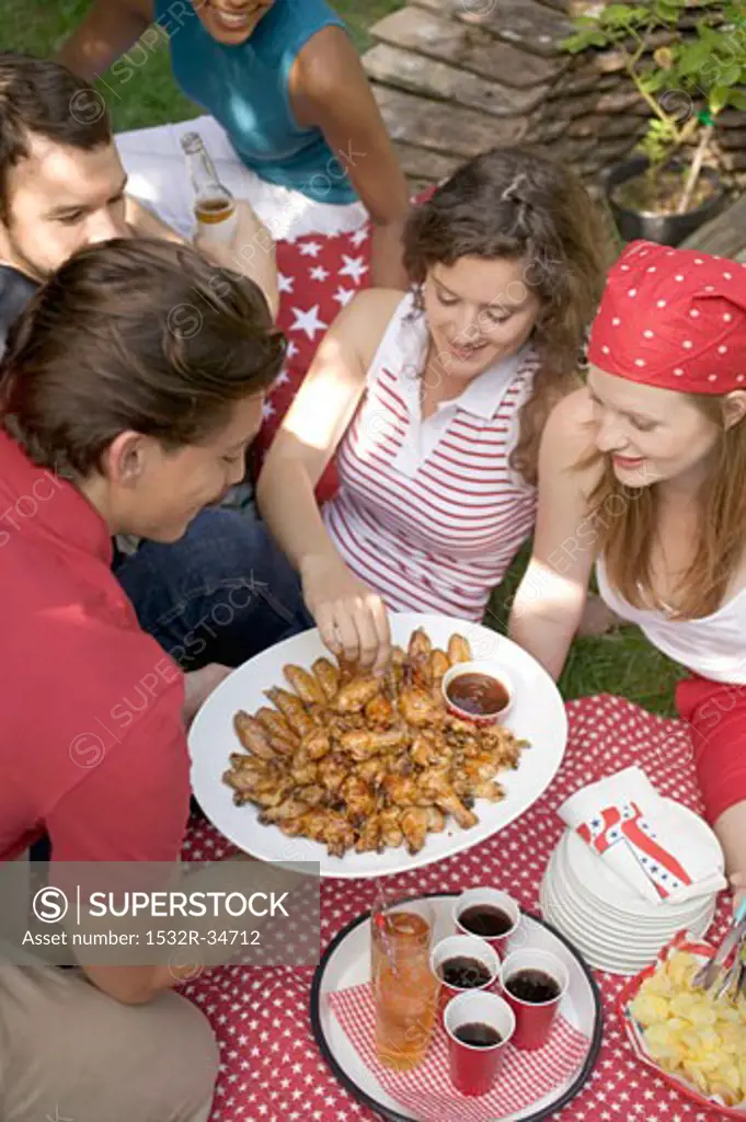 Young people at a 4th of July picnic