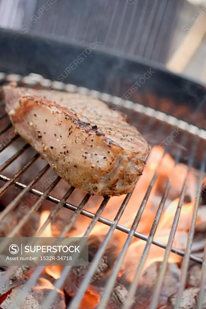 Beef steak on barbecue
