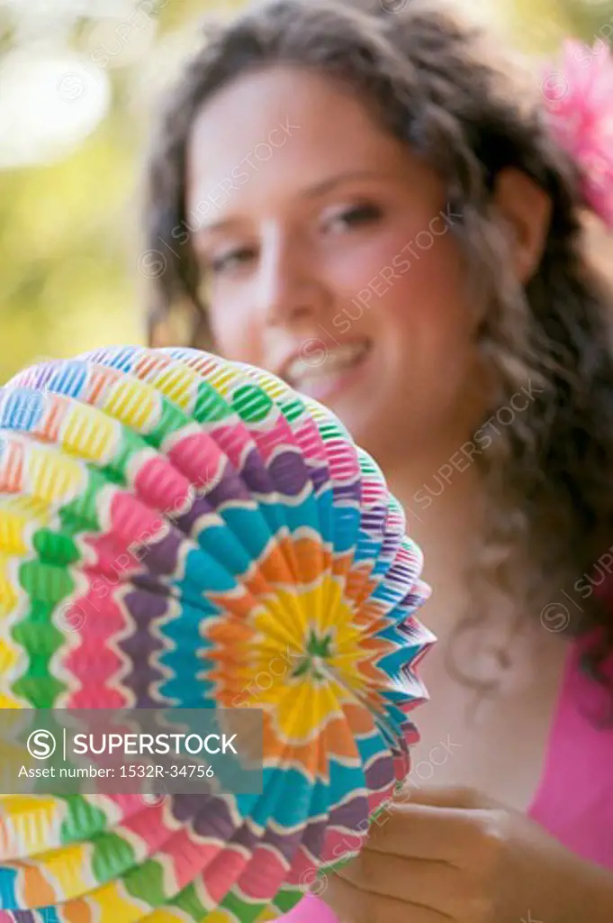 Woman holding coloured Chinese lantern