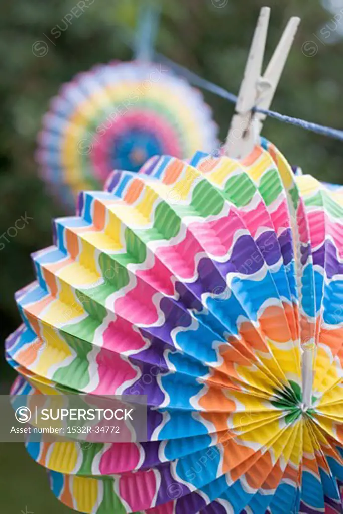 Coloured Chinese lanterns on washing line (garden party decorations)