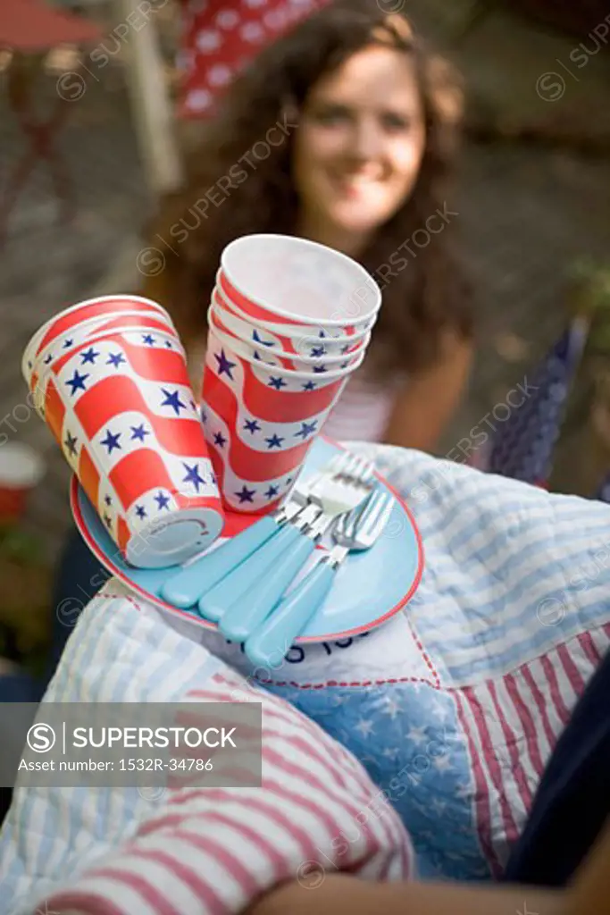 Picnic things for the 4th of July, woman in background