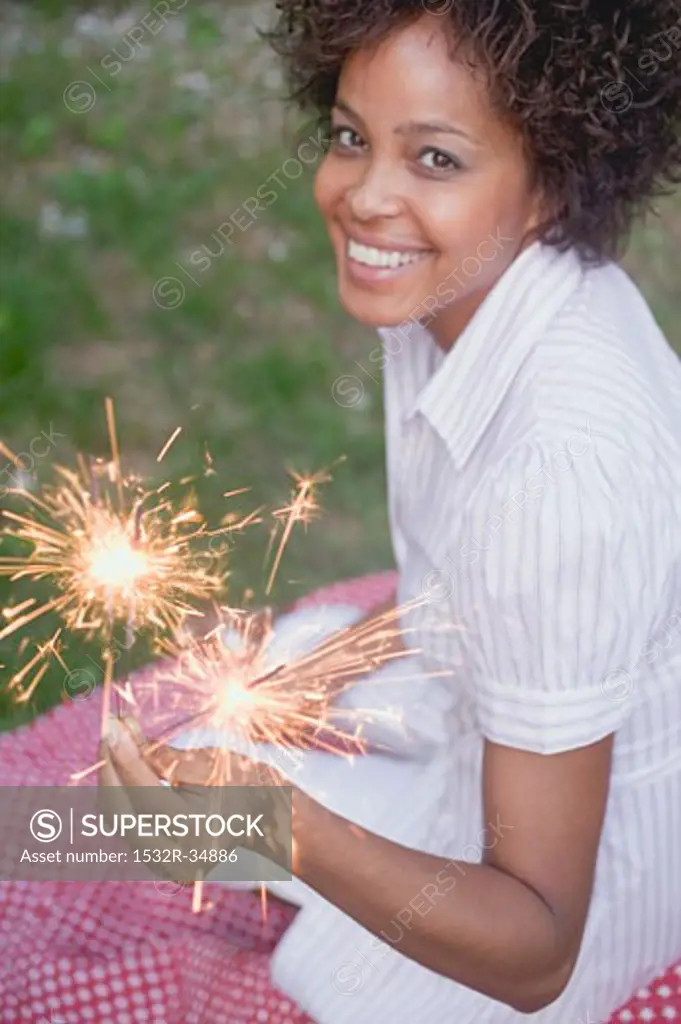 Woman holding sparklers