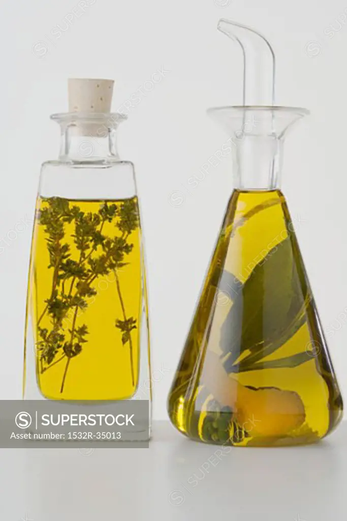 Two different herb oils in bottles