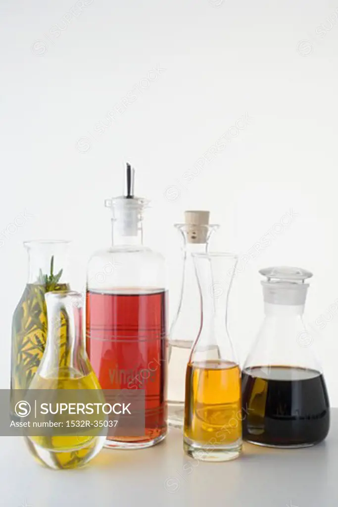 Various types of oil and vinegar in bottles