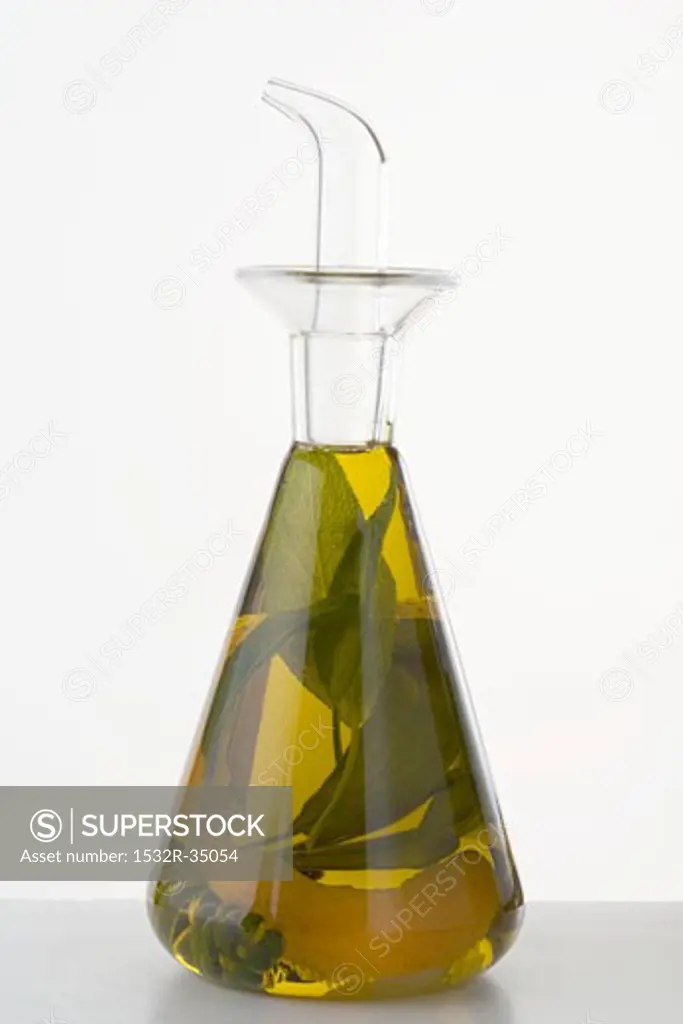 Herb oil with lemon peel in a bottle
