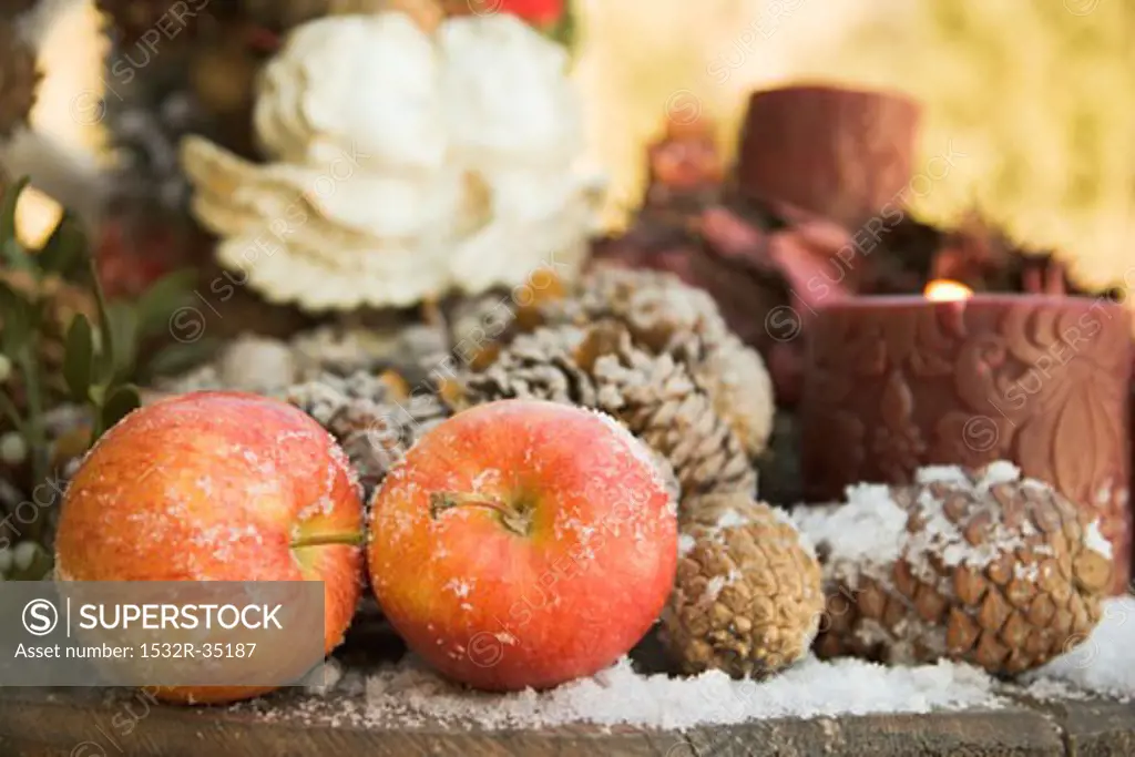 Christmas decoration with red apples and cones