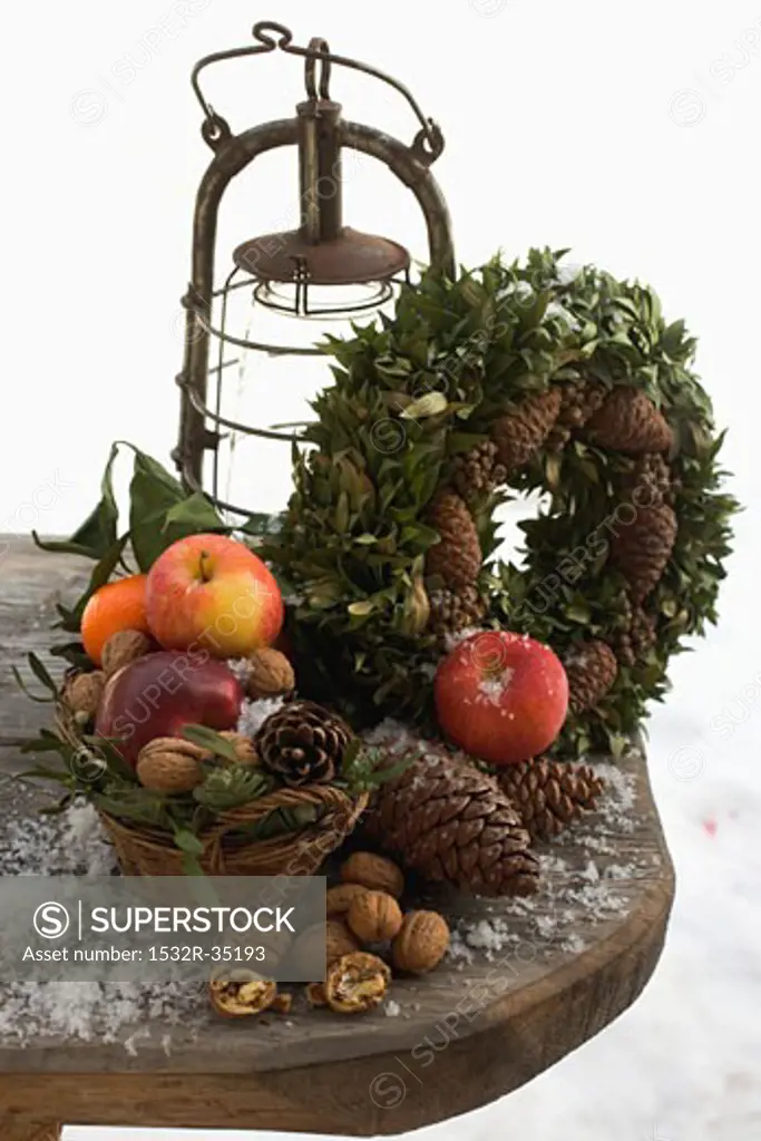 Rustic Christmas decorations on wooden table out of doors