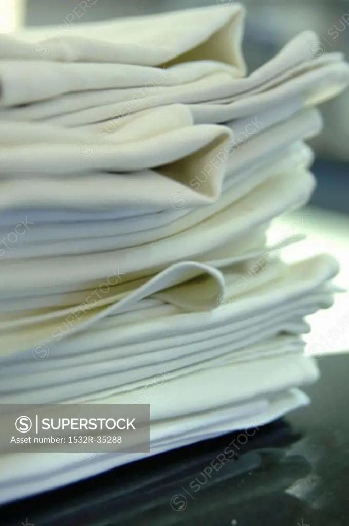 A pile of folded fabric napkins