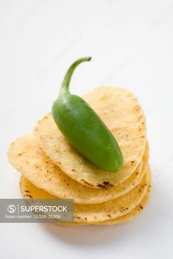 Tortilla chips with green jalapeno chilli