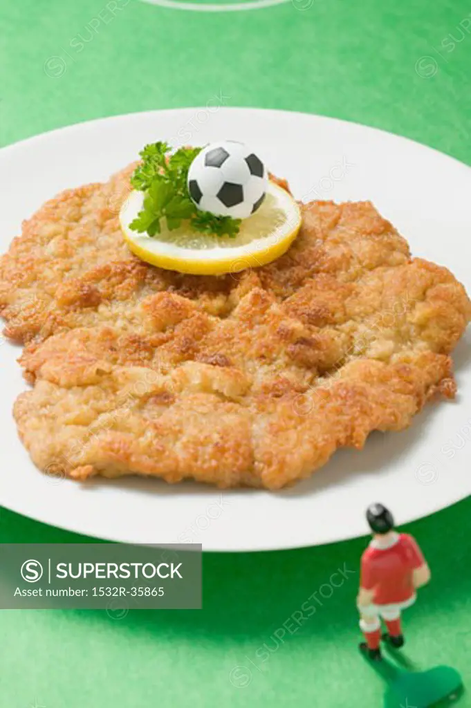 Wiener schnitzel (veal escalope) with football figure & football
