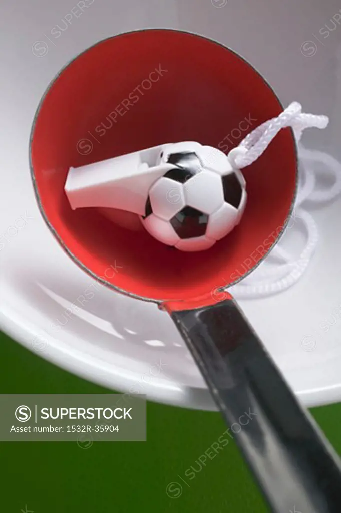 Football whistle in ladle