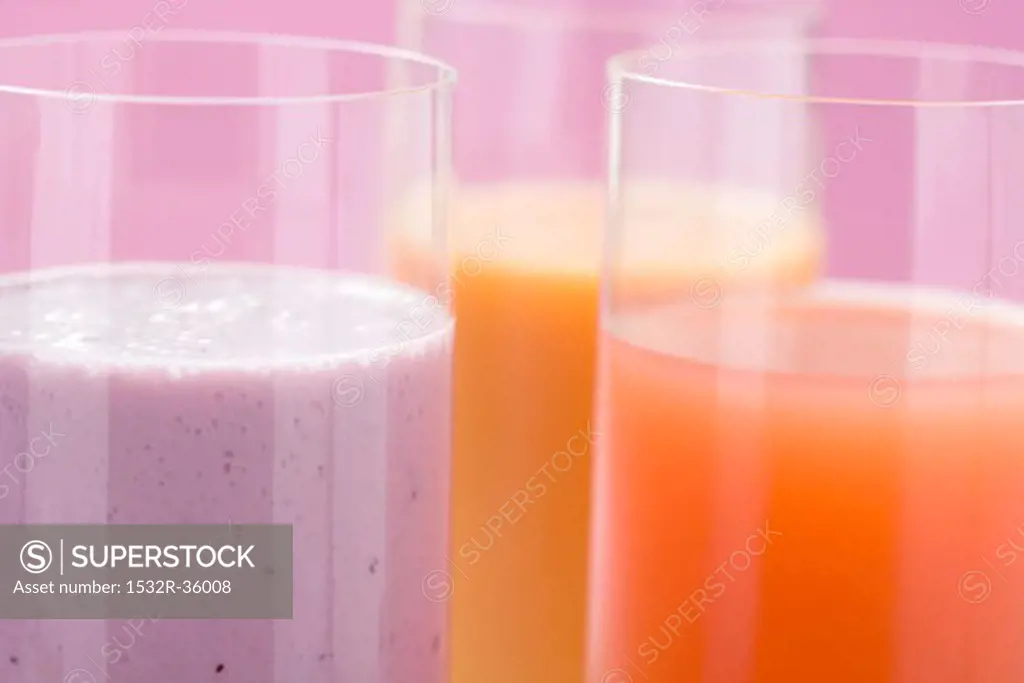 Blueberry milk and two different juices