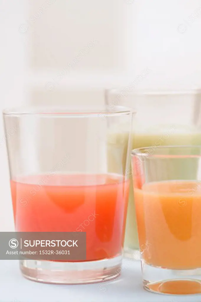 Three different juices in glasses