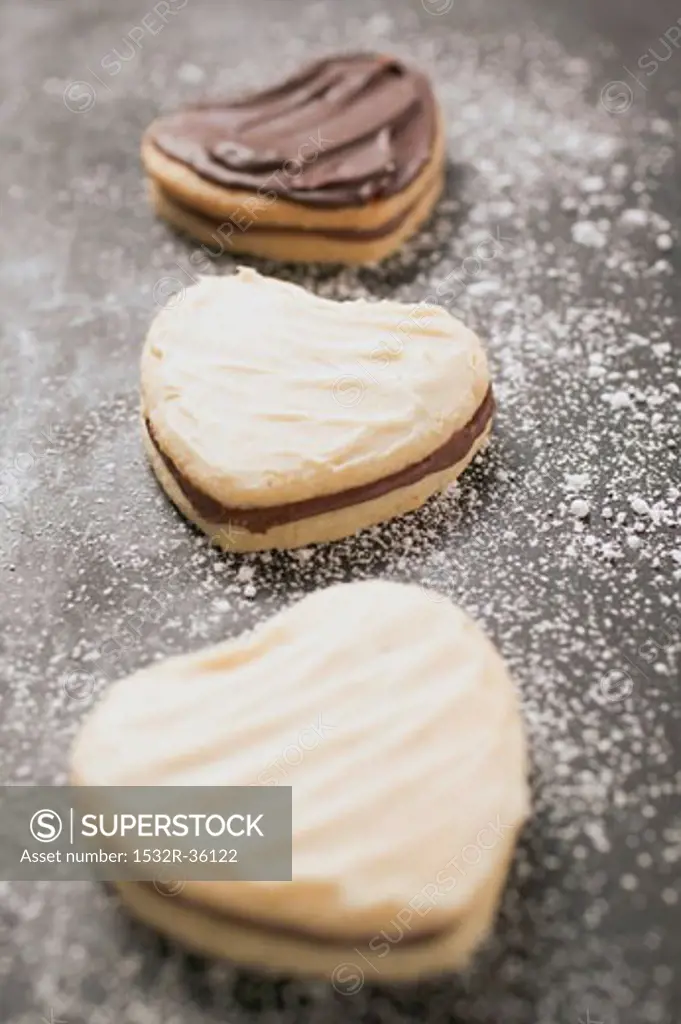Three heart-shaped Christmas biscuits
