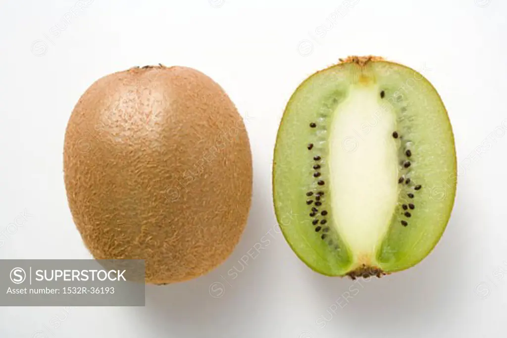 Whole kiwi fruit & half a kiwi fruit (longitudinal section)