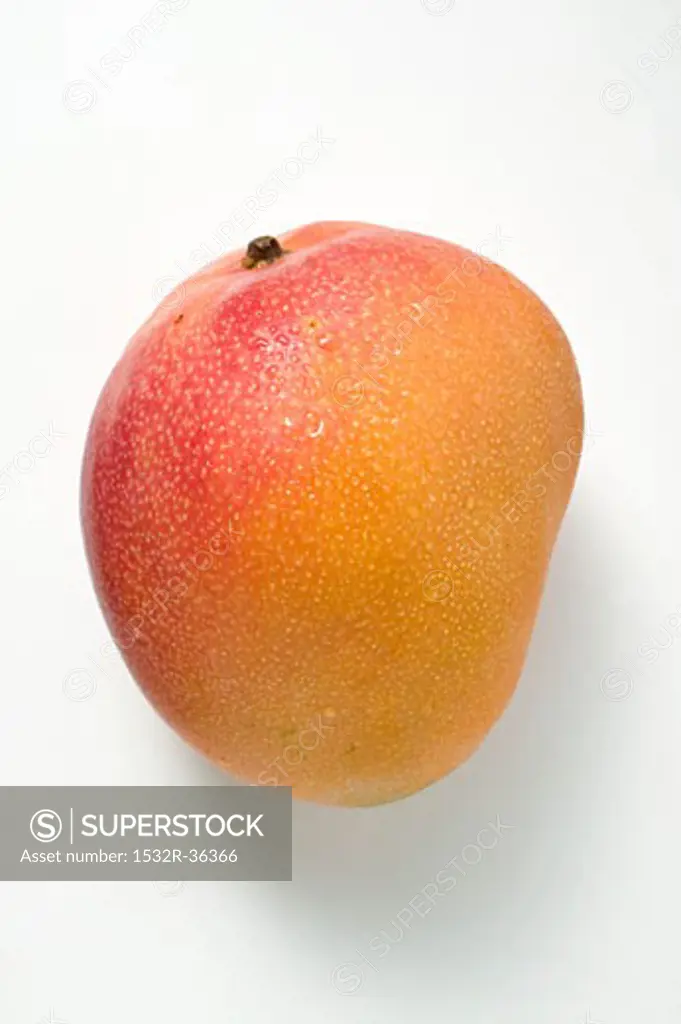 A mango with drops of water