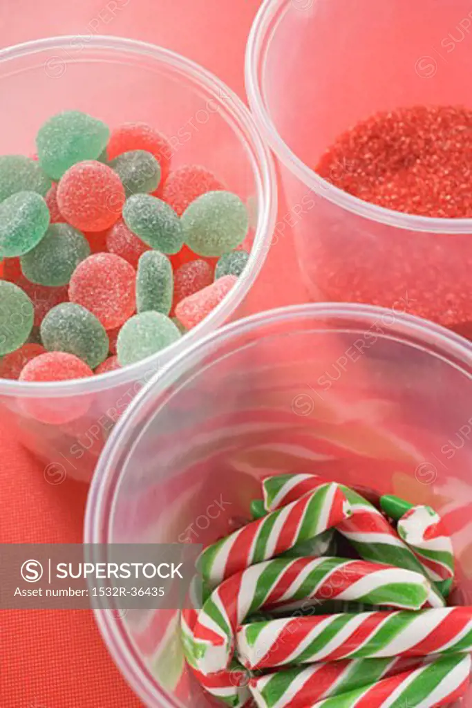 Jelly sweets, candy canes and red sugar